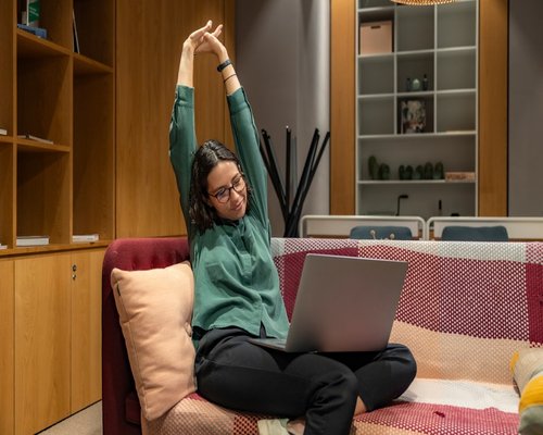 Woman doing yoga and stretching at home