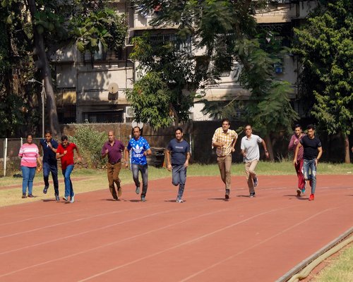 Group of people running together for health